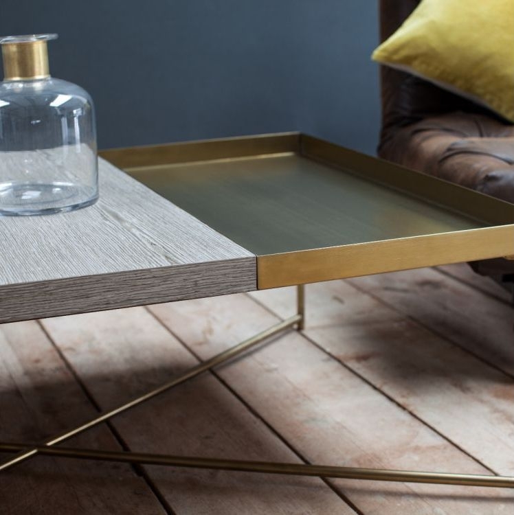 Product photograph of Gillmore Space Iris Weathered Oak Top Rectangular Coffee Table With Brass Tray And Brass Frame from Choice Furniture Superstore.