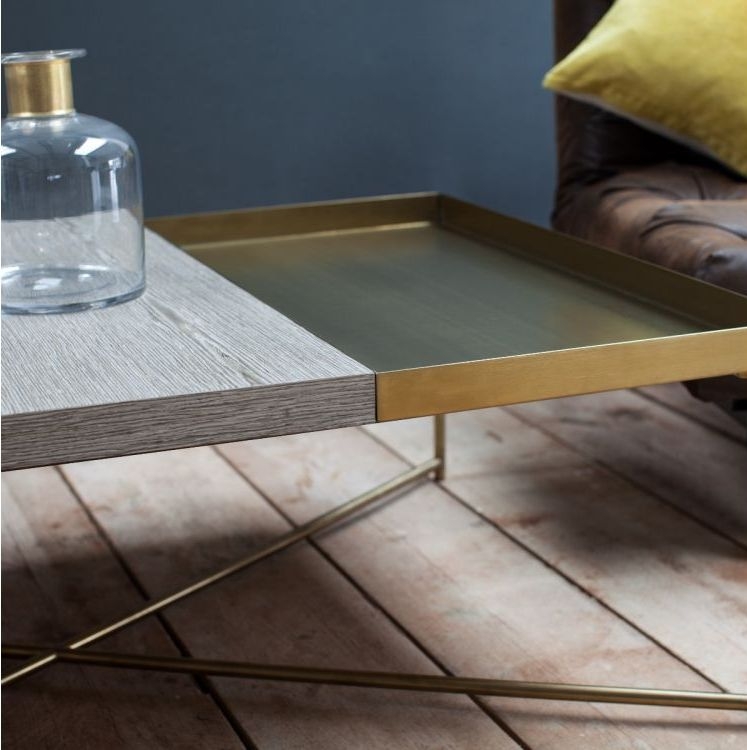 Product photograph of Gillmore Space Iris Weathered Oak Top Square Coffee Table With Brass Trays And Brass Frame from Choice Furniture Superstore.