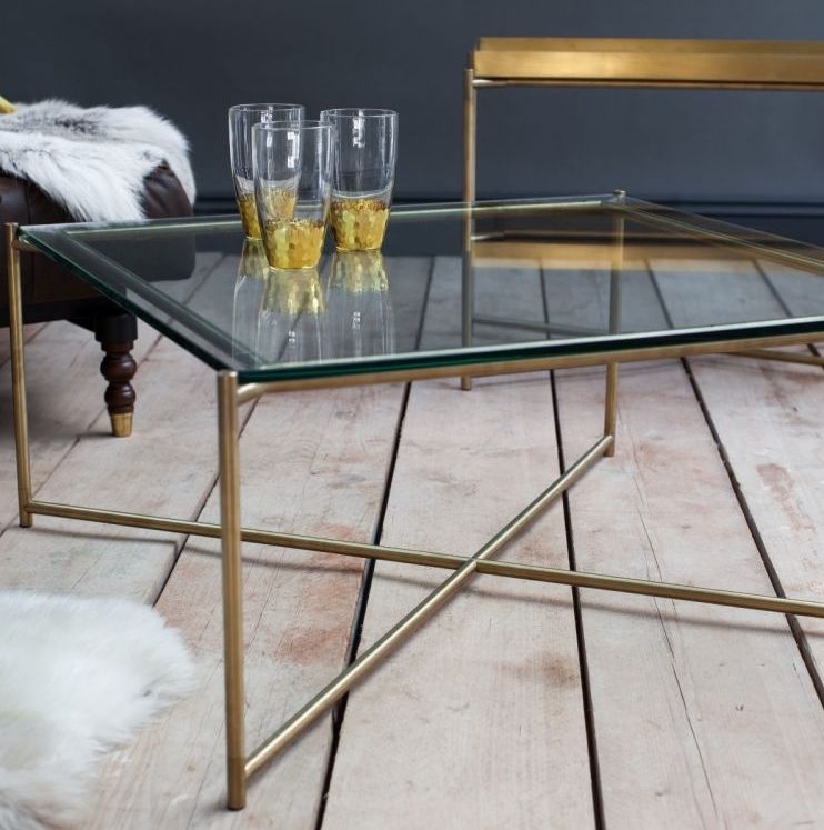 Product photograph of Gillmore Space Iris Clear Glass Top Square Coffee Table With Brass Frame from Choice Furniture Superstore.